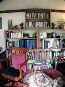 bookshelf, Teresa's writing chair, and small chair and chairs in her office